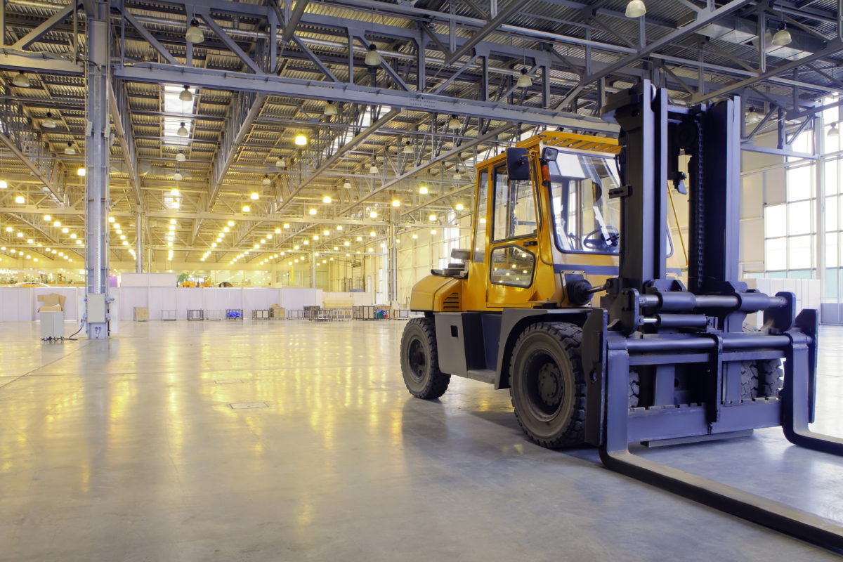 powered industrial lift truck in a warehouse
